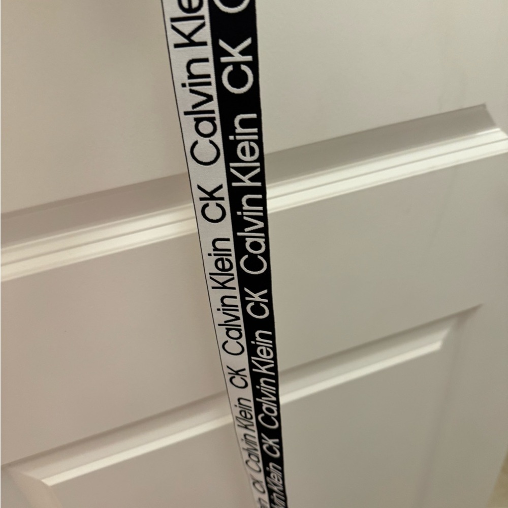 Calvin Klein, BELT bold black and white measured 63” long and very stretchy